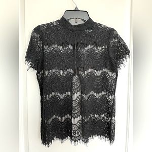 Never Worn brand new. Black lace style top. Very gorgeous.